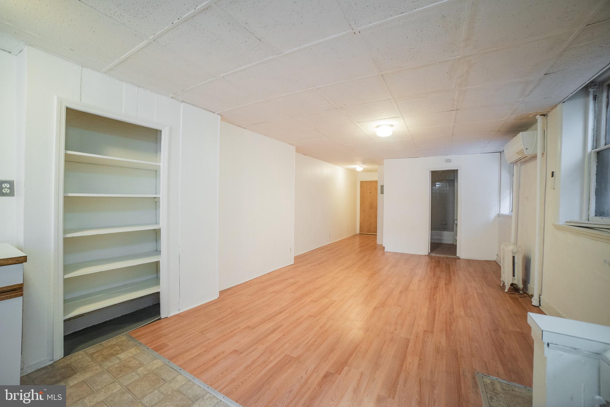 2116 Walnut Street Philadelphia, PA 19103 - Photo 4 of 12 a view of a room with a wooden floor