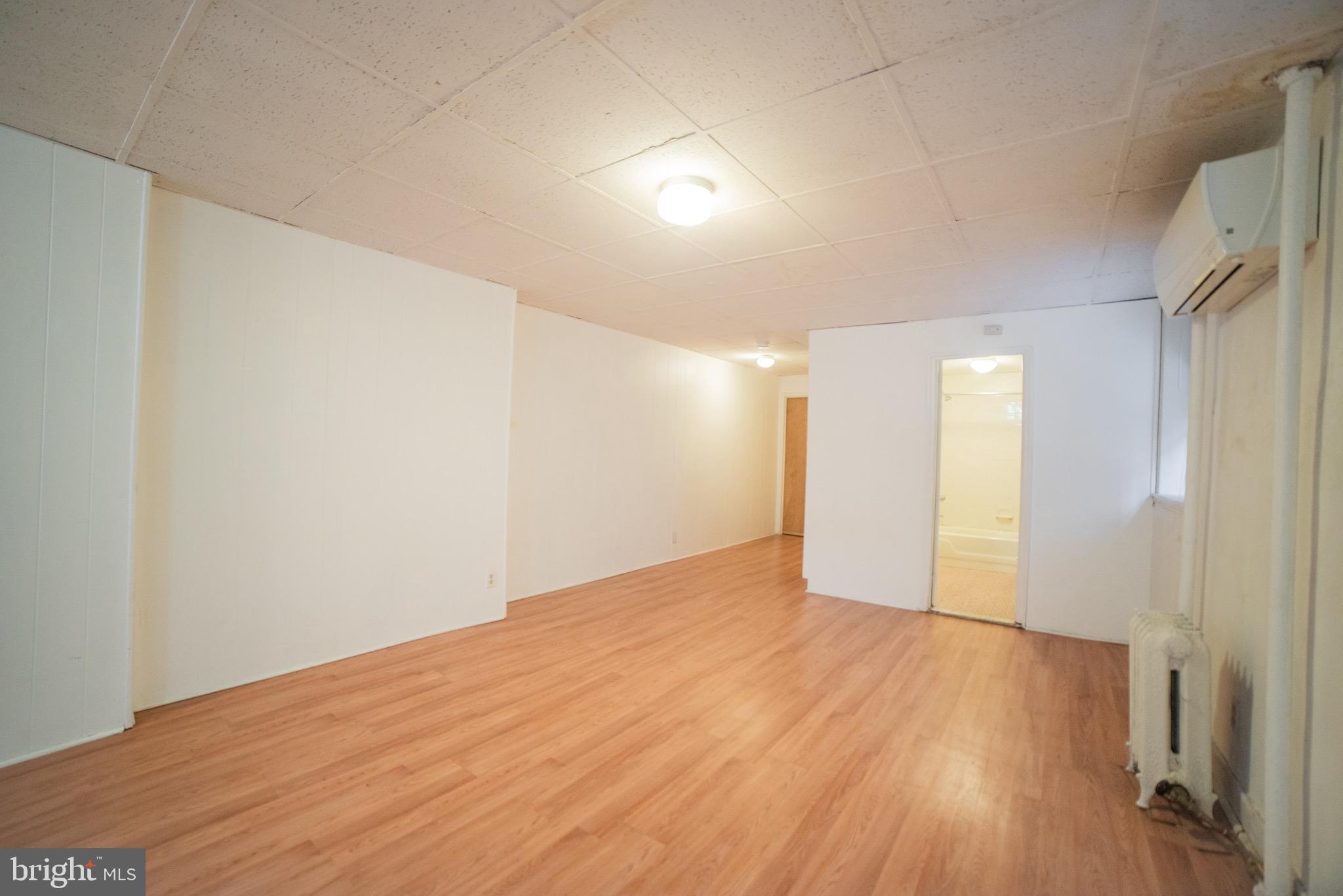 2116 Walnut Street Philadelphia, PA 19103 - Photo 8 of 12 a view of an empty room with wooden floor