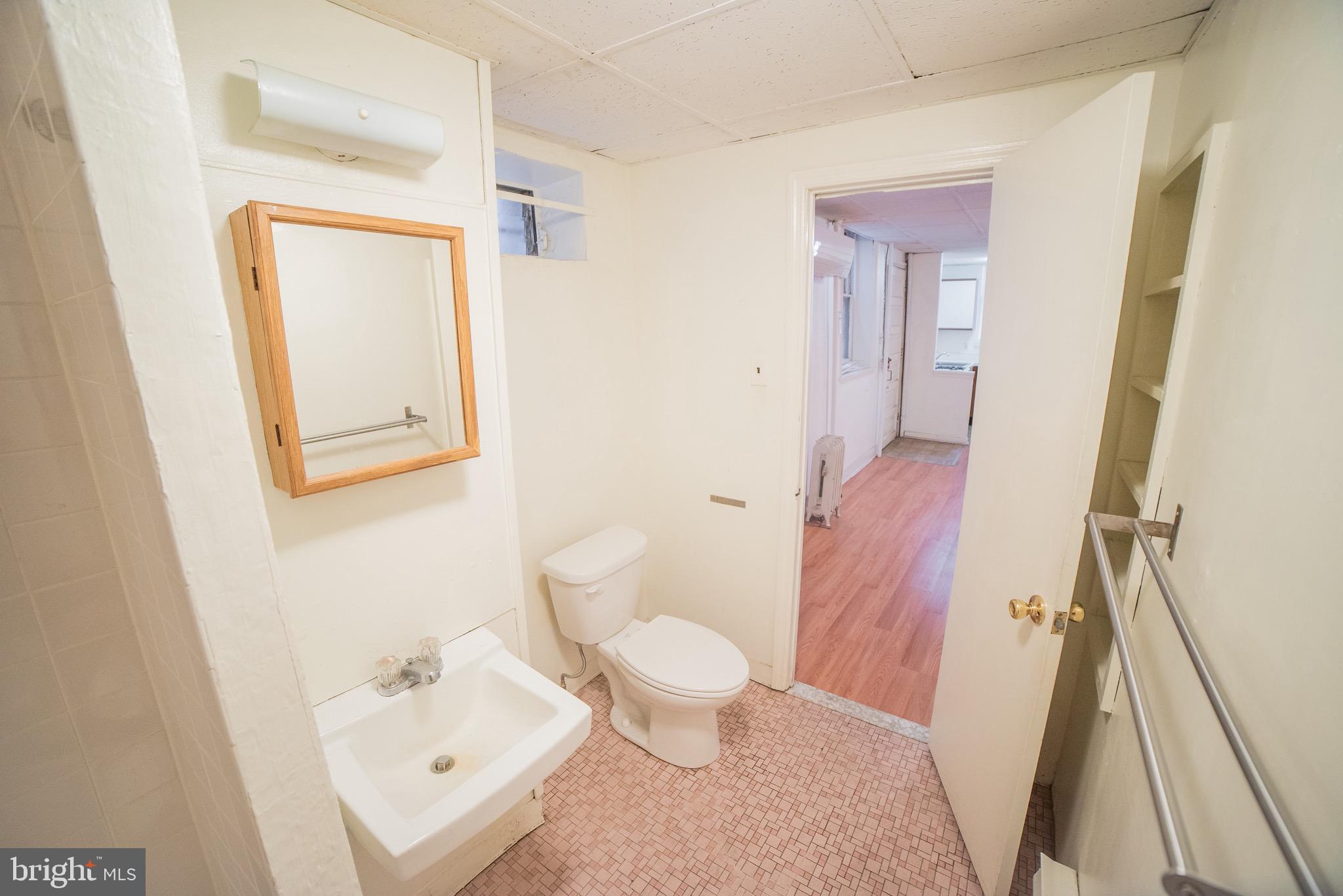 2116 Walnut Street Philadelphia, PA 19103 - Photo 9 of 12 a bathroom with a sink and a toilet
