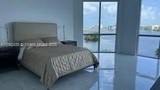 a bedroom with a bed and a mirror