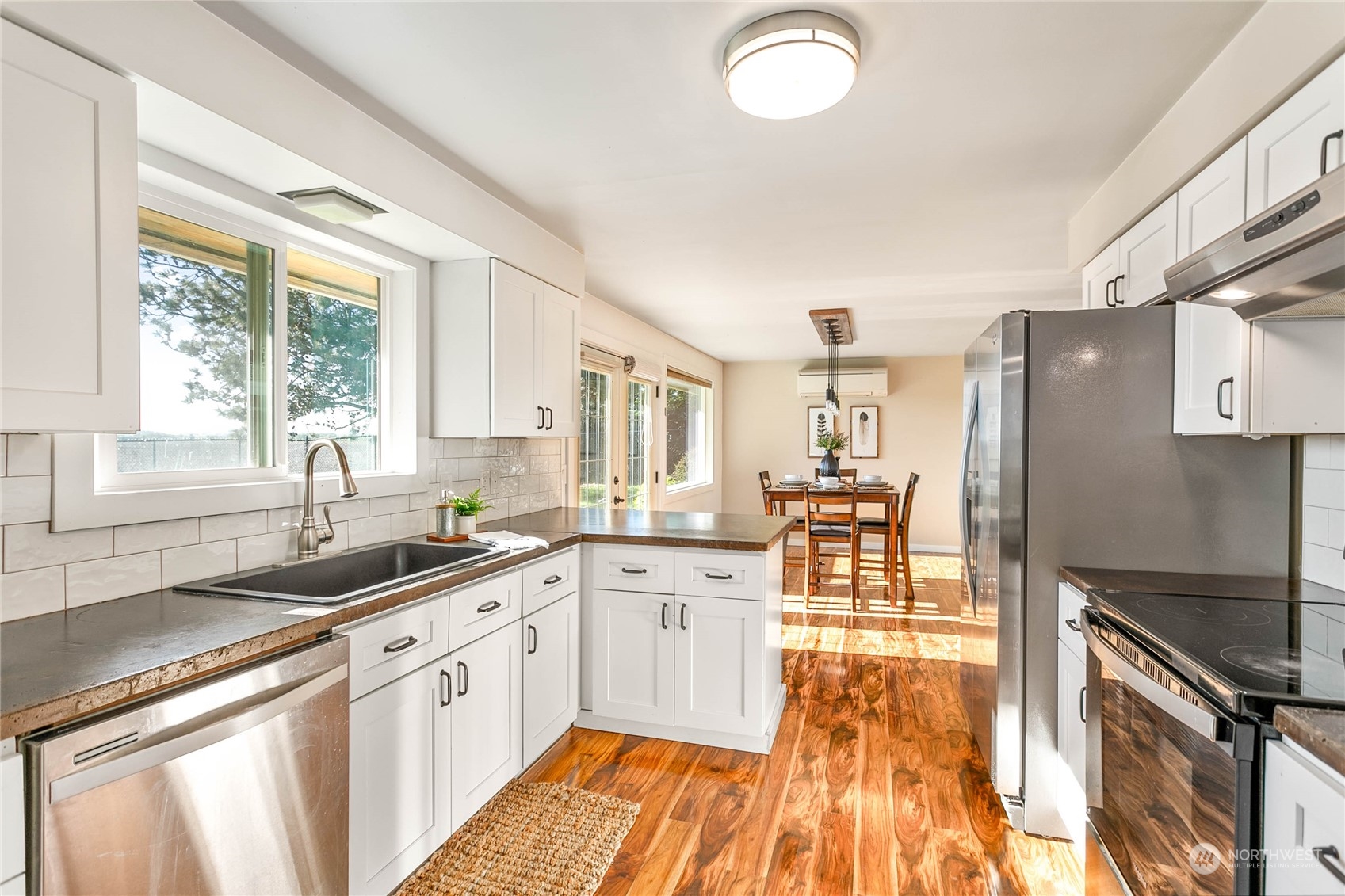 14486 Laconner Whitney Road La Conner, WA 98257 - Photo 16 of 40 a large kitchen with a sink and refrigerator