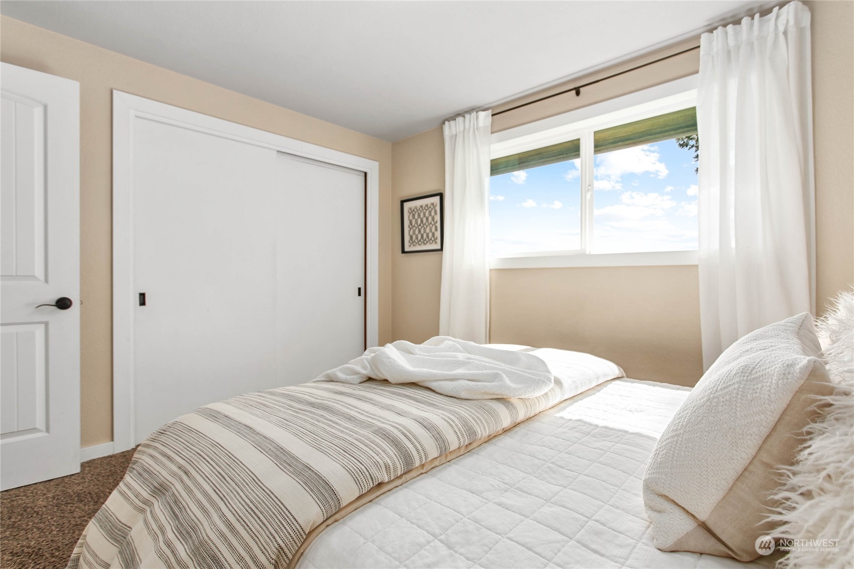 14486 Laconner Whitney Road La Conner, WA 98257 - Photo 24 of 40 a bedroom with a bed and a window