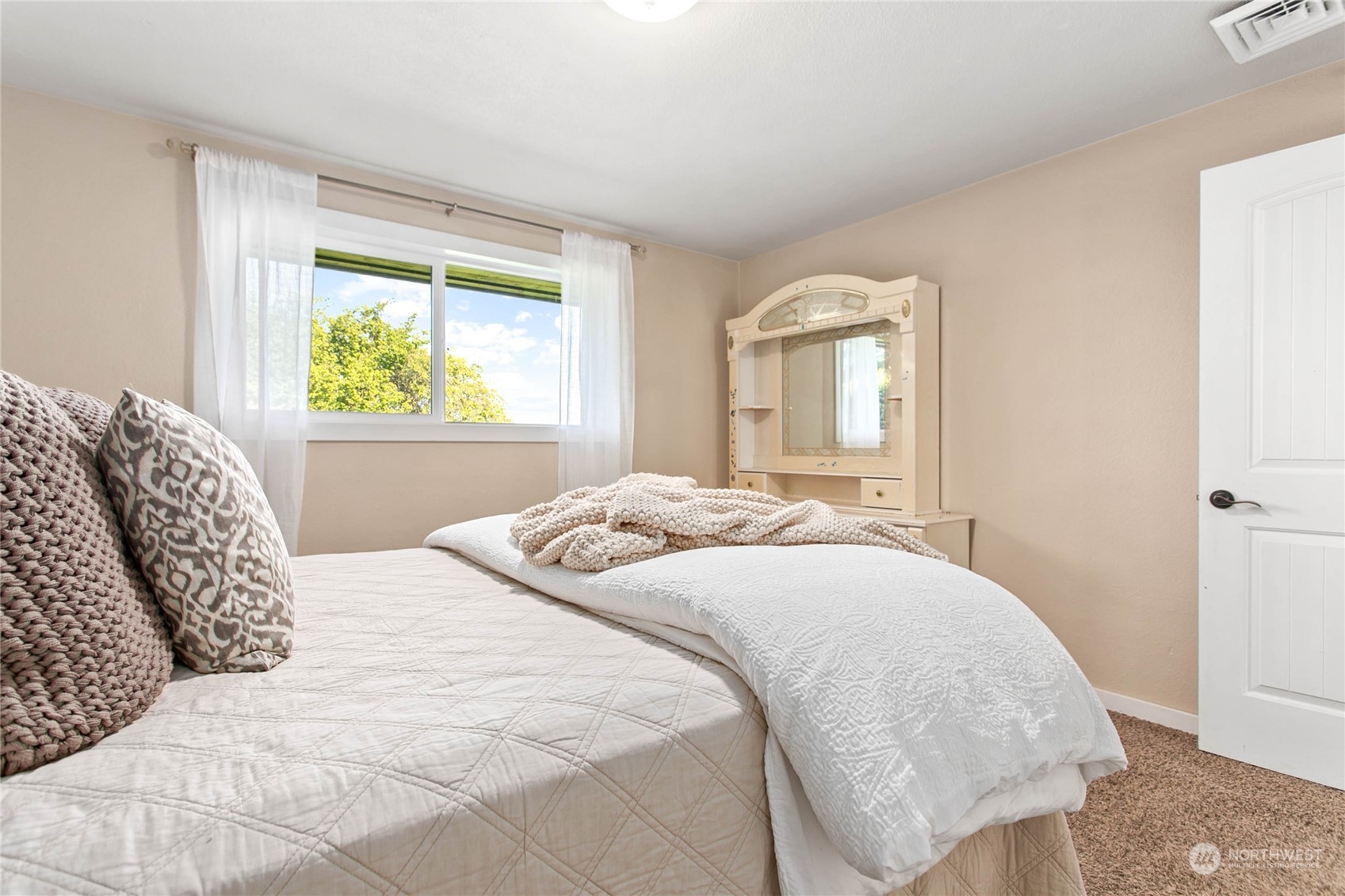 14486 Laconner Whitney Road La Conner, WA 98257 - Photo 28 of 40 a bedroom with a bed and a window