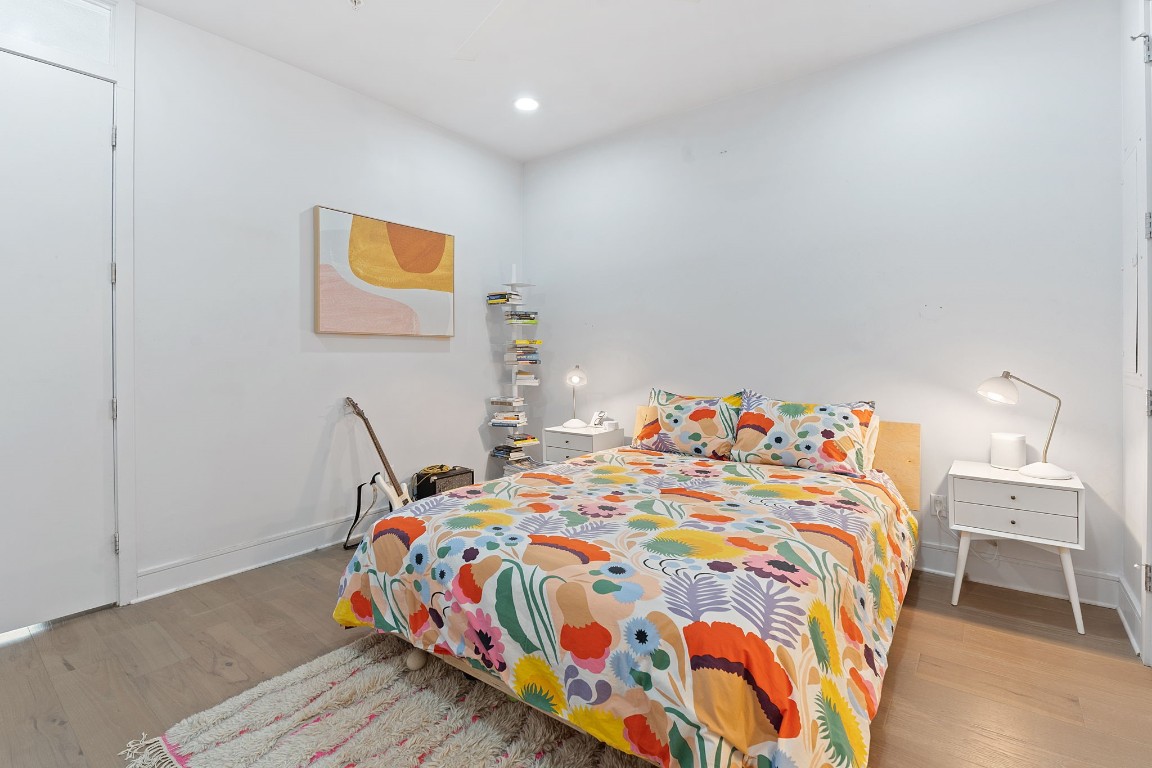 555 East 5th Street, Unit 817 Austin, TX 78701 - Photo 20 of 39 a bedroom with a bed and a lamp on dresser