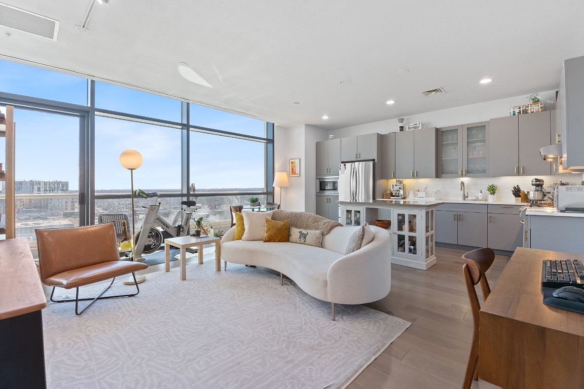 555 East 5th Street, Unit 817 Austin, TX 78701 - Photo 3 of 39 a living room with furniture and a large window