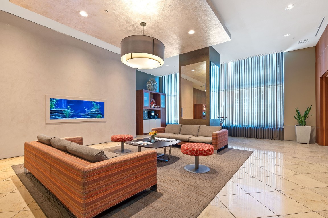 555 East 5th Street, Unit 817 Austin, TX 78701 - Photo 32 of 39 a living room with furniture and a large window