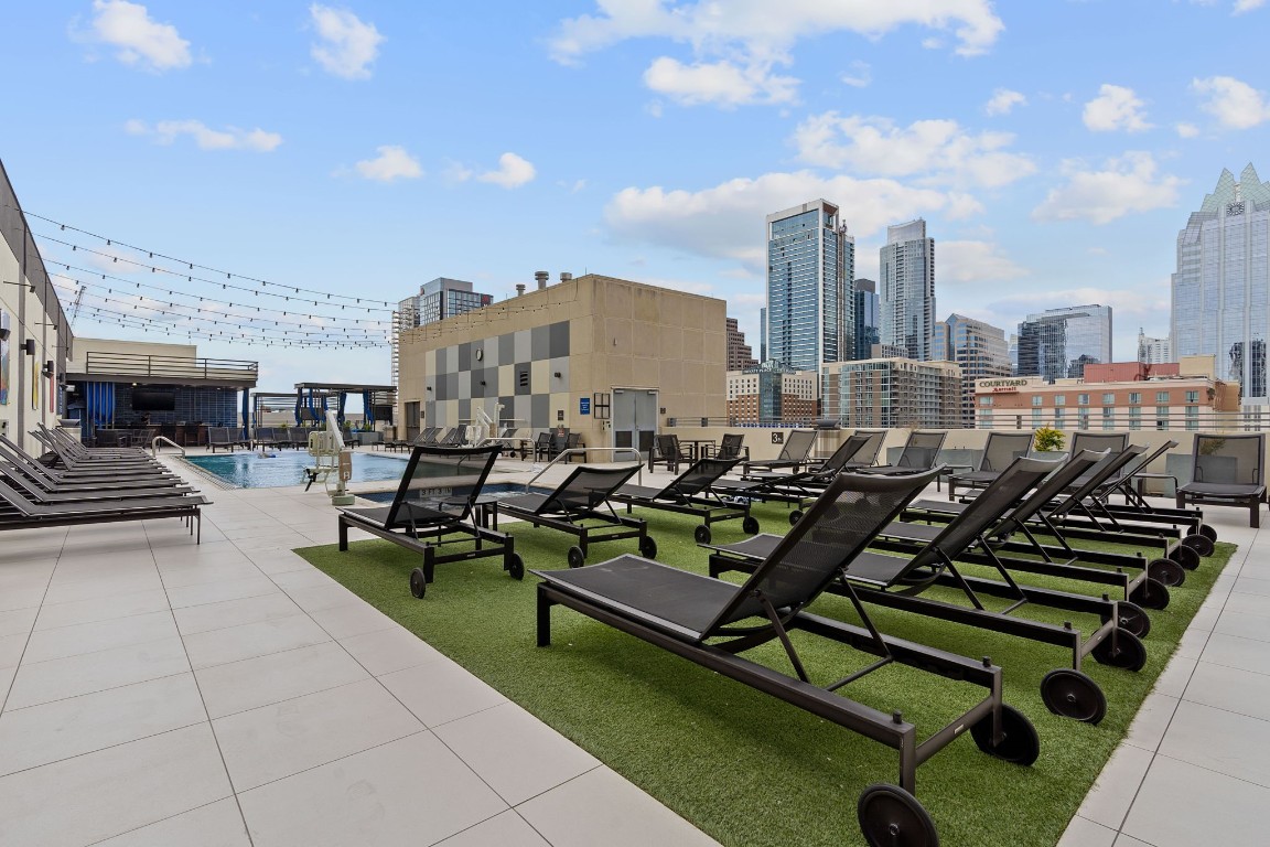 555 East 5th Street, Unit 817 Austin, TX 78701 - Photo 35 of 39 a living room with lots of furniture and a fireplace