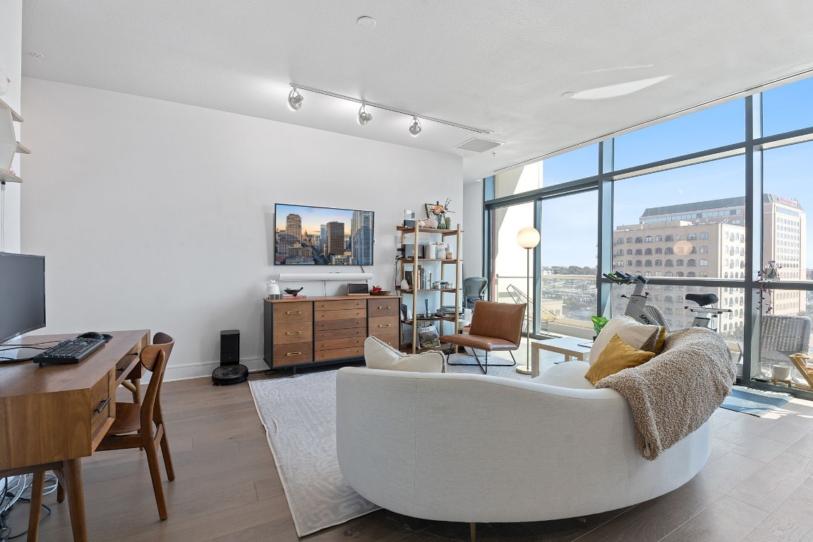 555 East 5th Street, Unit 817 Austin, TX 78701 - Photo 5 of 39 a living room with furniture and a large window