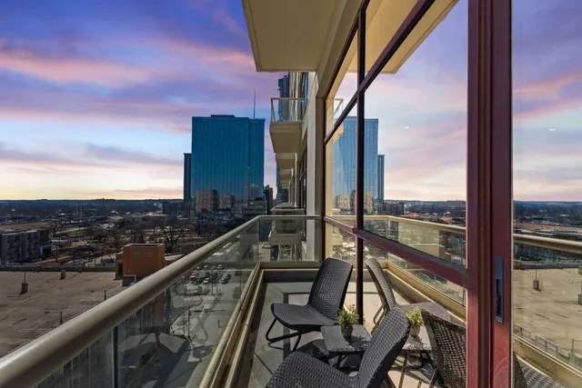 a kitchen with stainless steel appliances granite countertop a sink and dishwasher a refrigerator with wooden cabinets