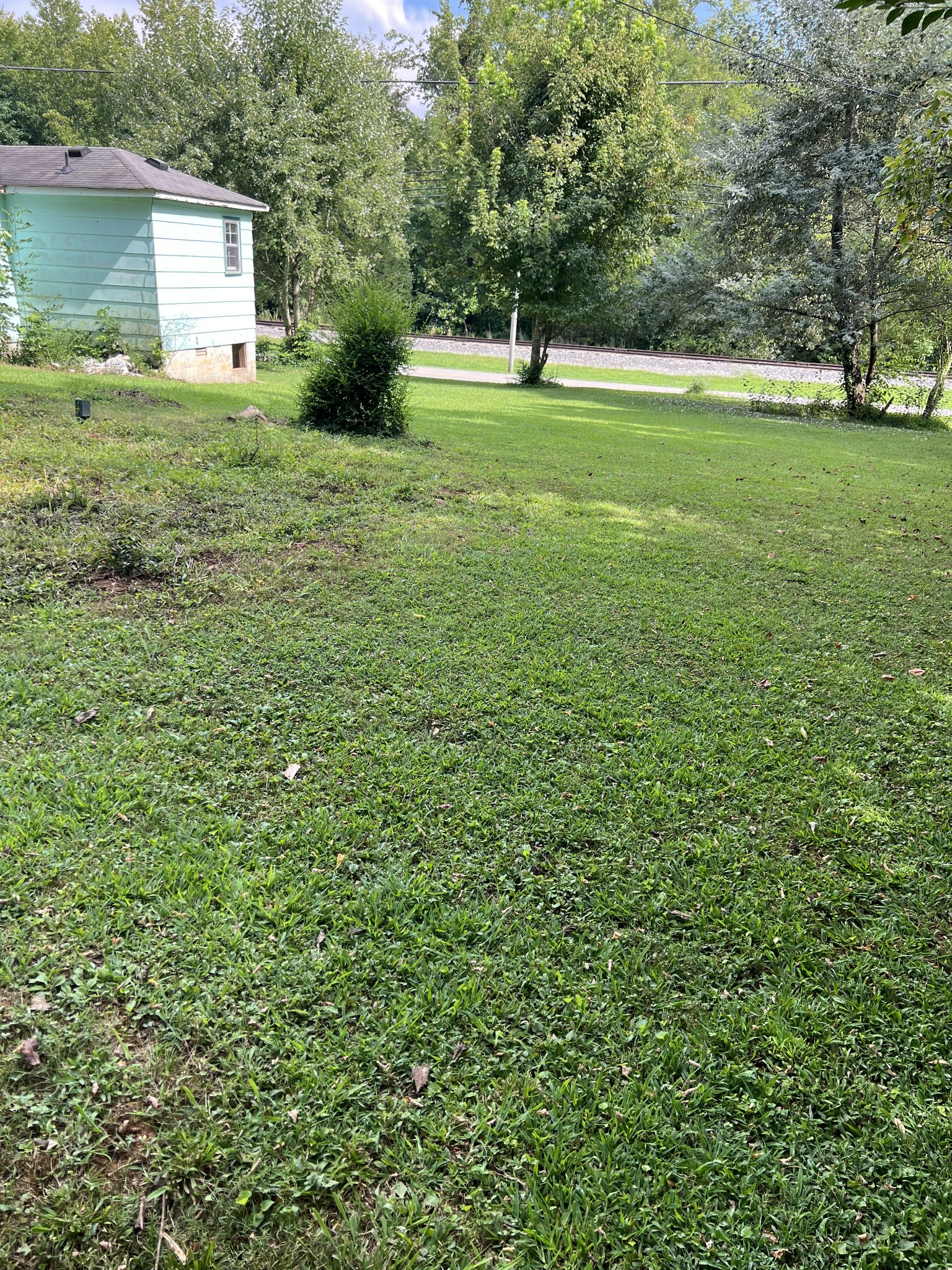 512 Main Street Baxter, TN 38544 - Photo 14 of 24 a view of a house with a backyard