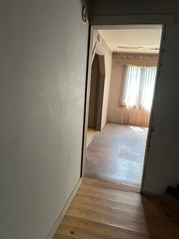 a view of a hallway with closet