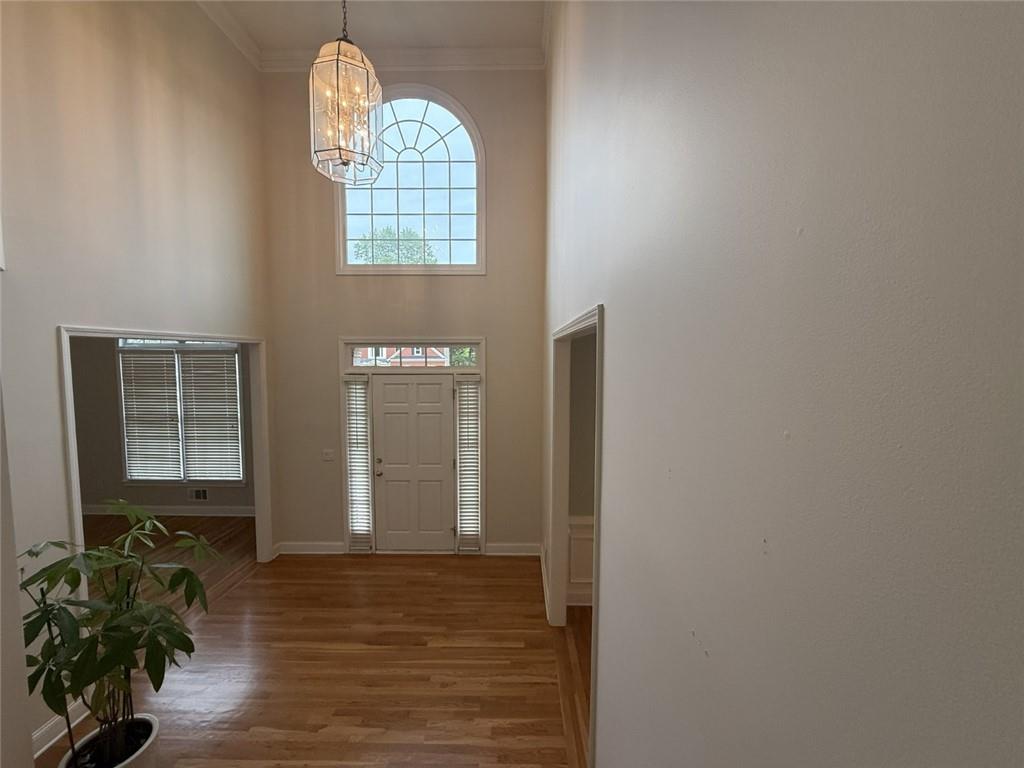 5730 Devonshire Way Cumming, GA 30040 - Photo 13 of 55 a view of entryway with wooden floor