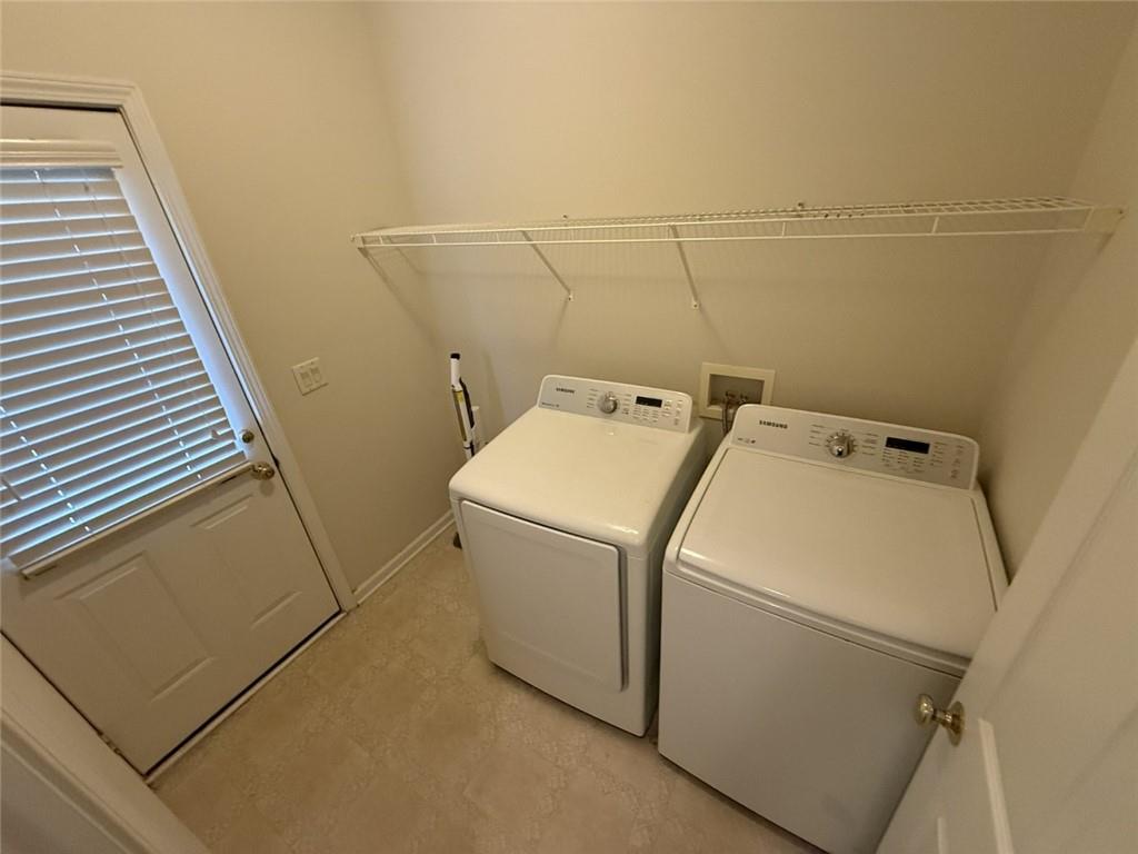 5730 Devonshire Way Cumming, GA 30040 - Photo 17 of 55 a utility room with dryer and washer