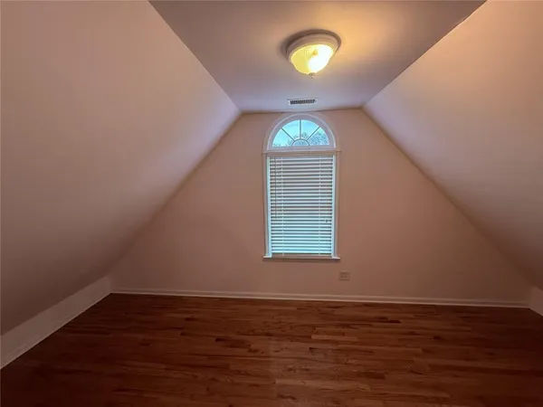 a view of wooden floor in a bathroom