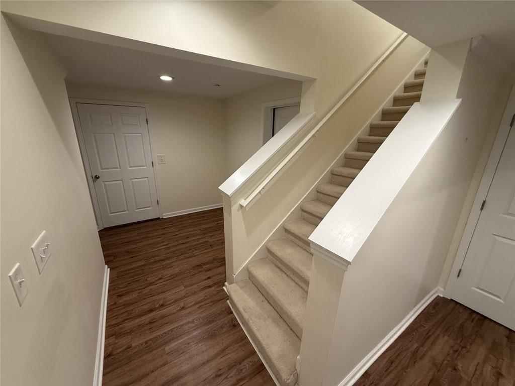 5730 Devonshire Way Cumming, GA 30040 - Photo 24 of 55 a view of entryway and hall with wooden floor