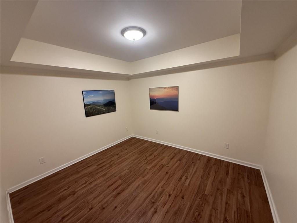 5730 Devonshire Way Cumming, GA 30040 - Photo 28 of 55 a view of an empty room with wooden floor