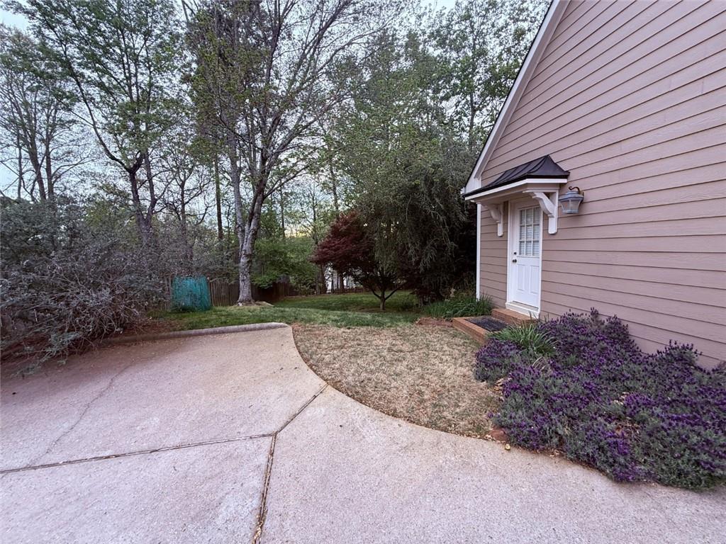 5730 Devonshire Way Cumming, GA 30040 - Photo 39 of 55 a view of a house with a yard