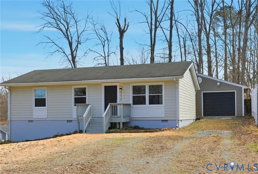 a view of a house with a yard and garage