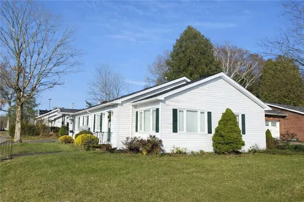 a view of a house with a yard