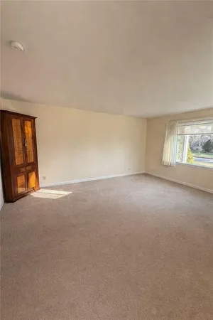 a bedroom with bed and window