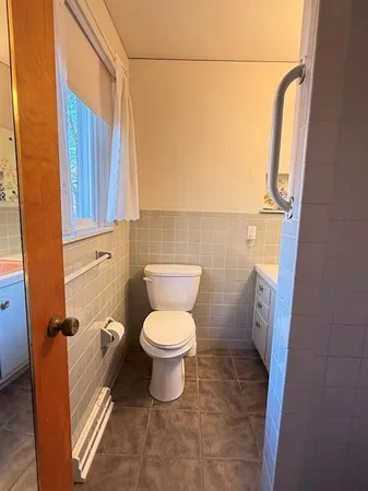a bedroom with bed and window