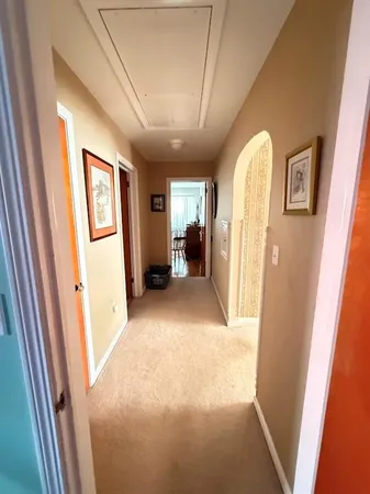 a bedroom with two beds and a dresser