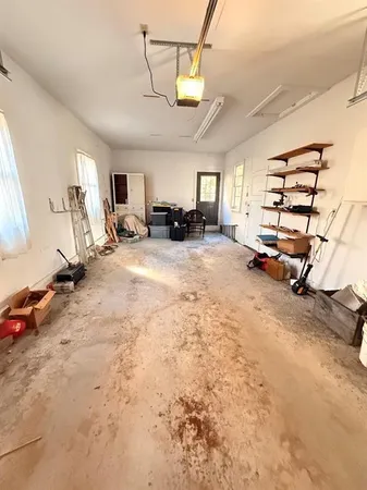 a view of a garage with wooden floor