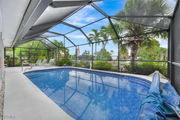 a view of swimming pool with a patio