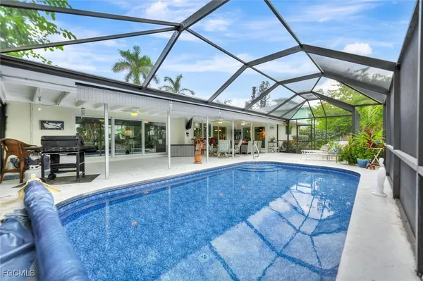 a view of swimming pool with outdoor seating