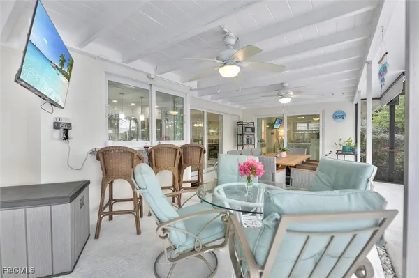a living room with furniture a dining table and chairs