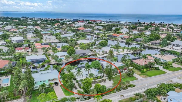 an aerial view of residential houses with outdoor space