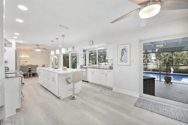 a view of a living room and kitchen