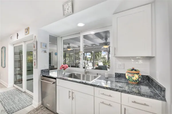 a kitchen with sink and window