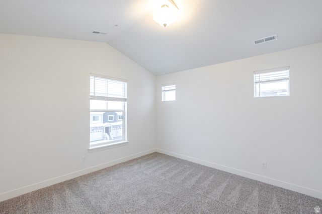709 West 4500th South, Unit N301 Mapleton, UT 84664 - Photo 6 of 17 Spare room with vaulted ceiling and light colored carpet