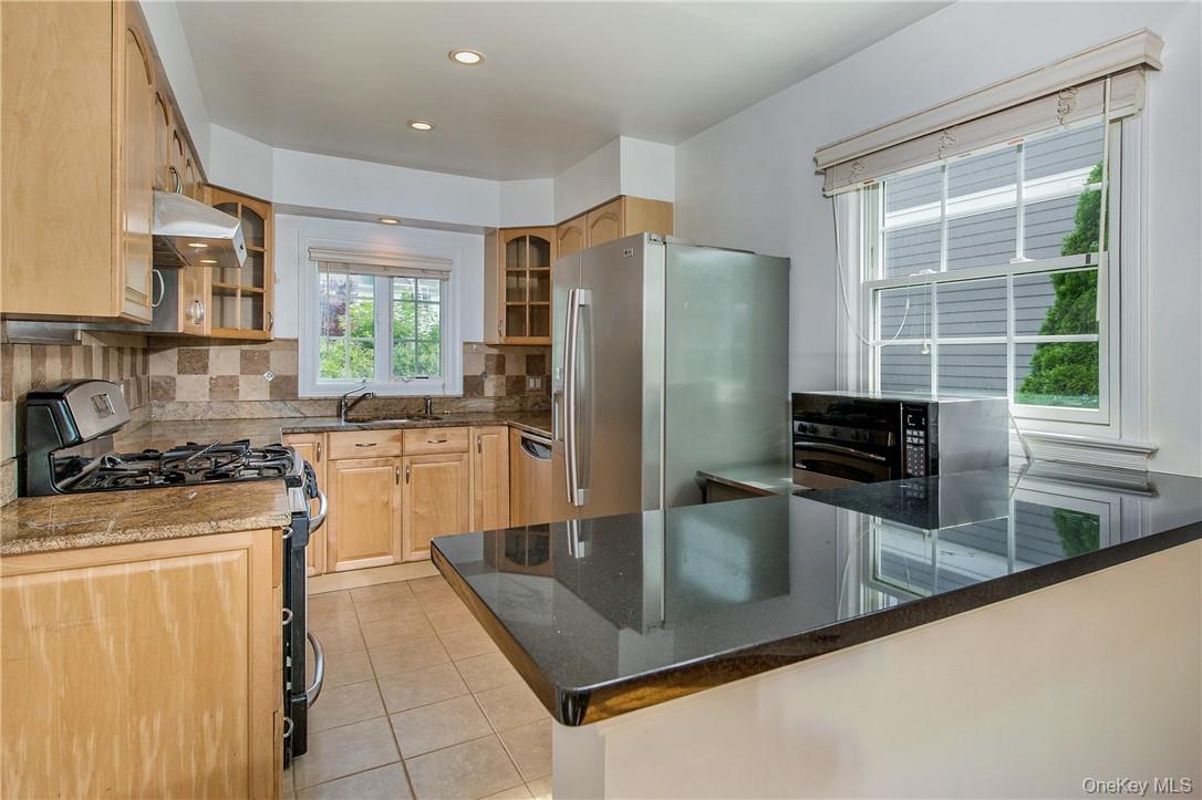 74 Dearborn Avenue Rye, NY 10580 - Photo 6 of 17 Kitchen with granite countertops and stainless steel applicances