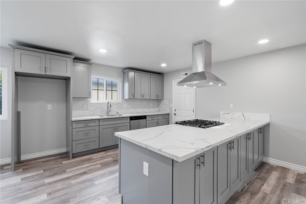 19309 Belshaw Avenue Carson, CA 90746 - Photo 11 of 40 a kitchen with a stove a sink and a refrigerator
