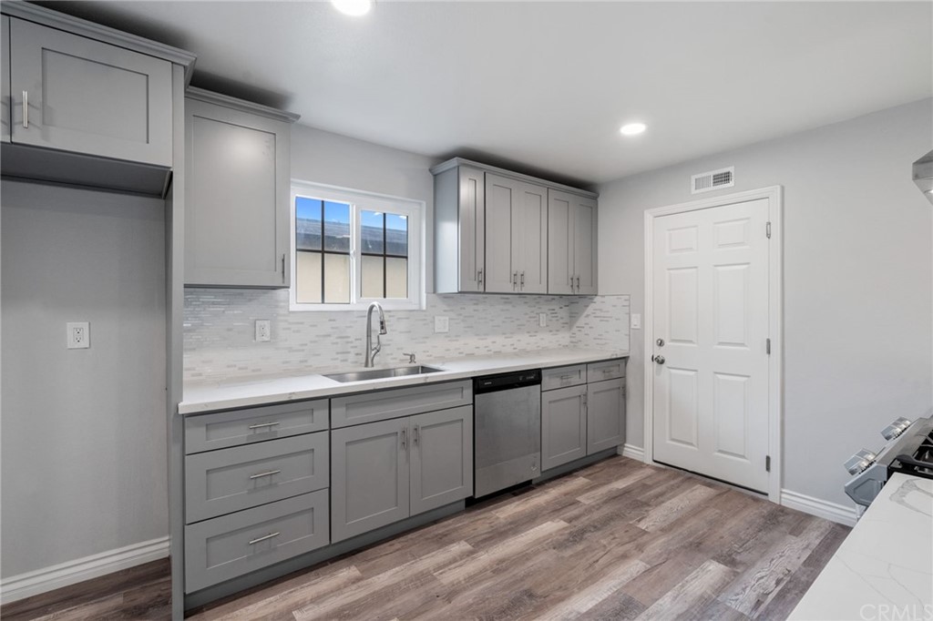 19309 Belshaw Avenue Carson, CA 90746 - Photo 12 of 40 a kitchen with sink and cabinets