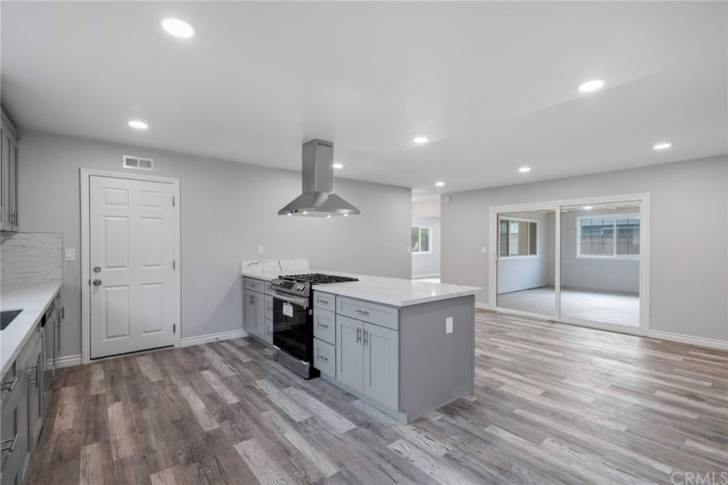 19309 Belshaw Avenue Carson, CA 90746 - Photo 13 of 40 a kitchen with a stove and a sink
