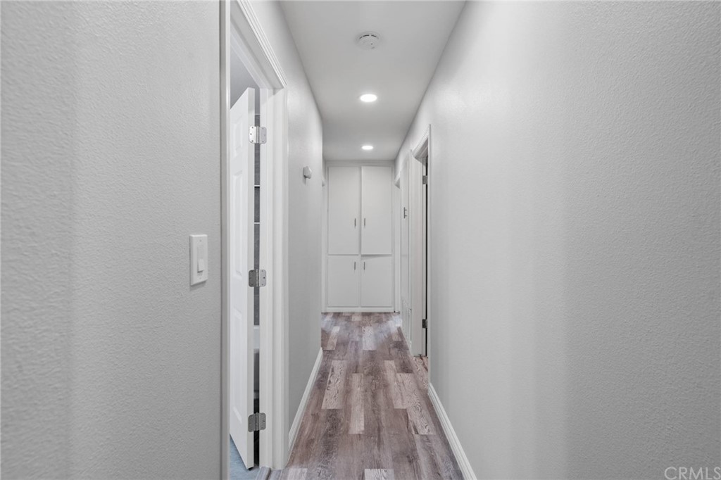 19309 Belshaw Avenue Carson, CA 90746 - Photo 14 of 40 a view of hallway with wooden floor
