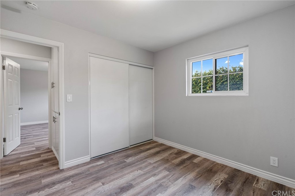 19309 Belshaw Avenue Carson, CA 90746 - Photo 25 of 40 a view of empty room with wooden floor and fan