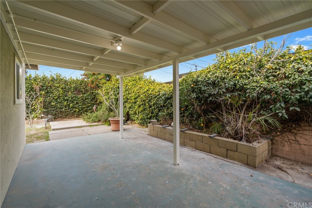 19309 Belshaw Avenue Carson, CA 90746 - Photo 28 of 40 a view of a room with wooden floor and iron stairs