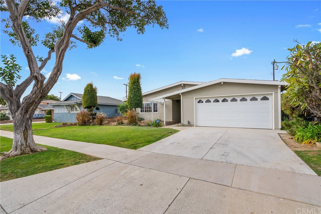 19309 Belshaw Avenue Carson, CA 90746 - Photo 3 of 40 a view of a house with a yard and large tree