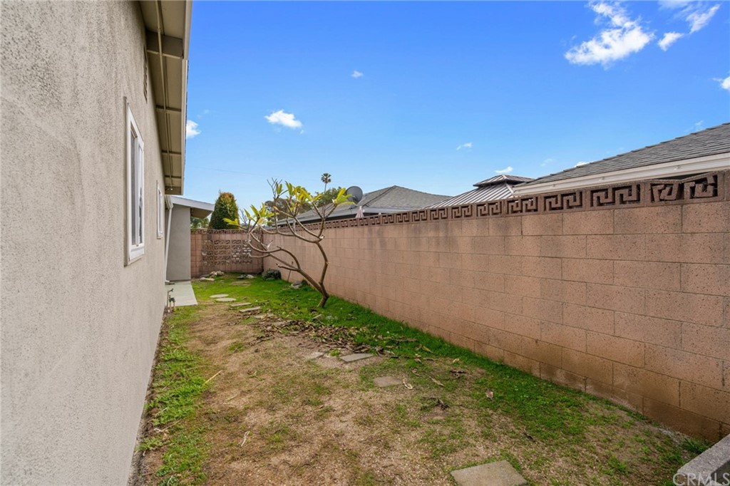 19309 Belshaw Avenue Carson, CA 90746 - Photo 31 of 40 a view of a backyard with pathway