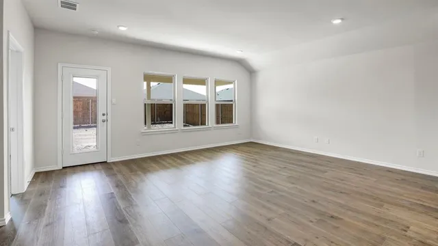 a view of an empty room with a window