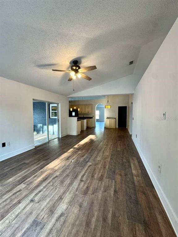 7132 Landmark Drive Spring Hill, FL 34606 - Photo 9 of 14 a view of empty room with a window and fireplace