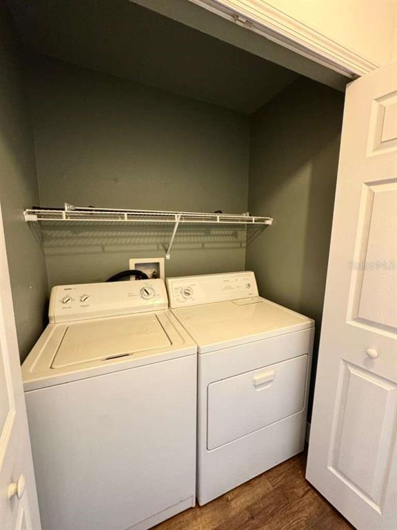 7132 Landmark Drive Spring Hill, FL 34606 - Photo 10 of 14 a utility room with dryer and washer
