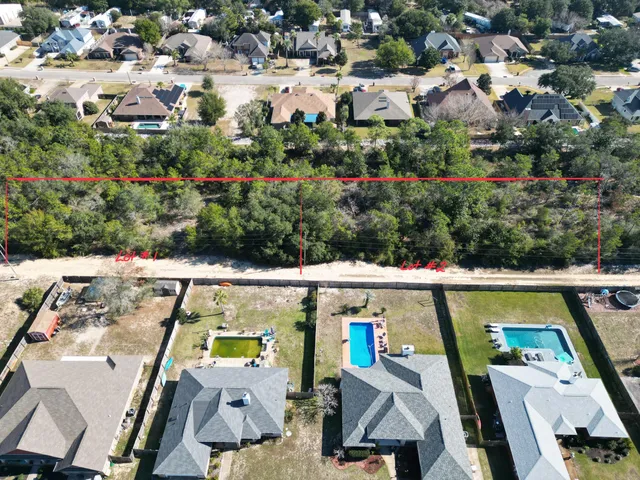 an aerial view of multiple houses with outdoor space