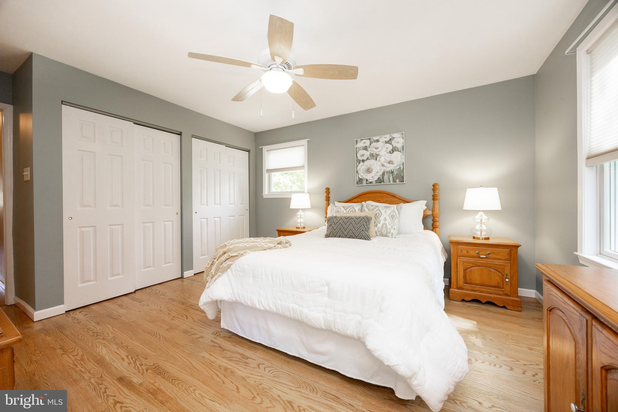402 Concord Avenue Exton, PA 19341 - Photo 16 of 39 a bedroom with a large bed and a chandelier