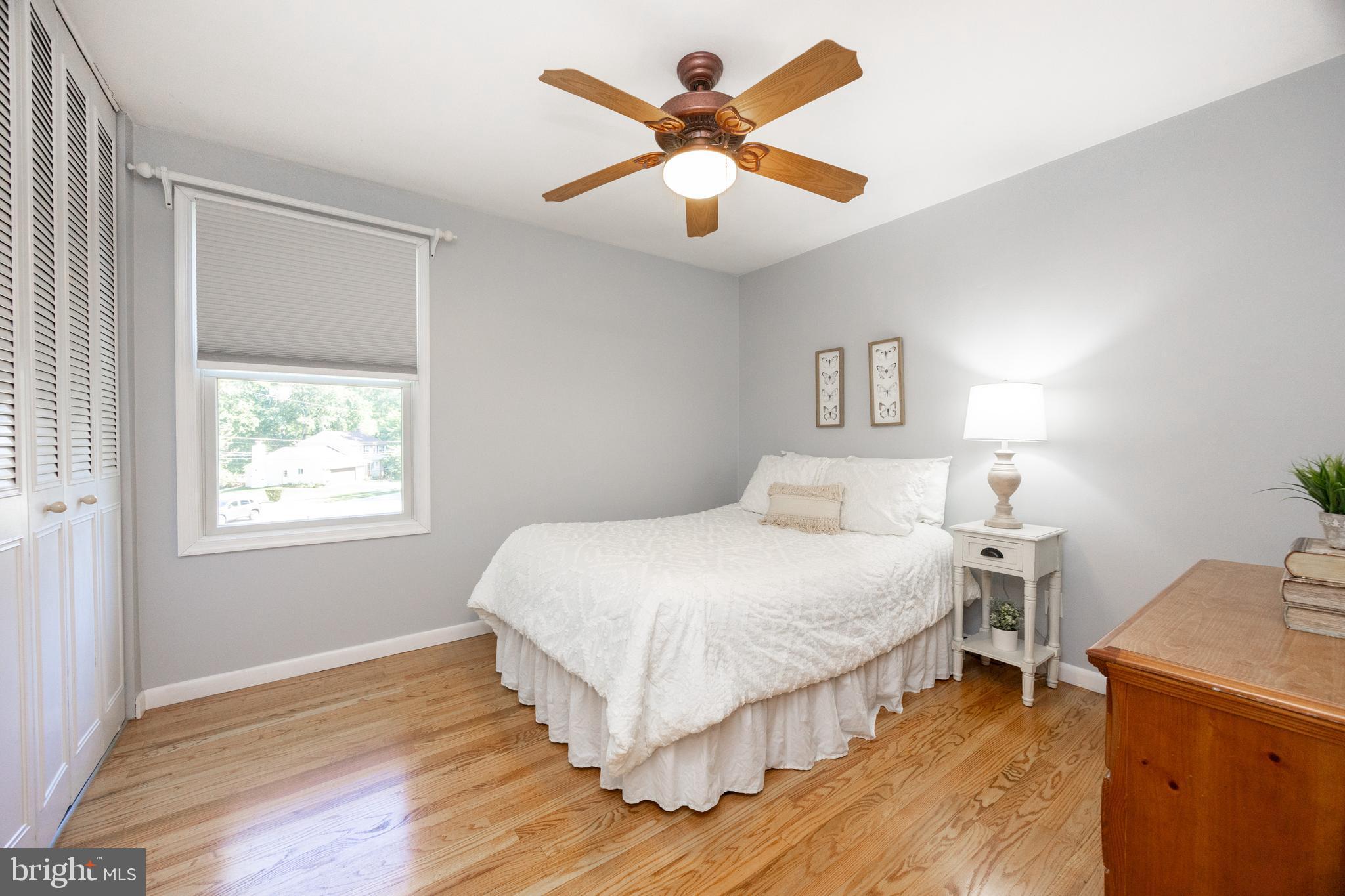 402 Concord Avenue Exton, PA 19341 - Photo 23 of 39 a bedroom with a bed and a chandelier
