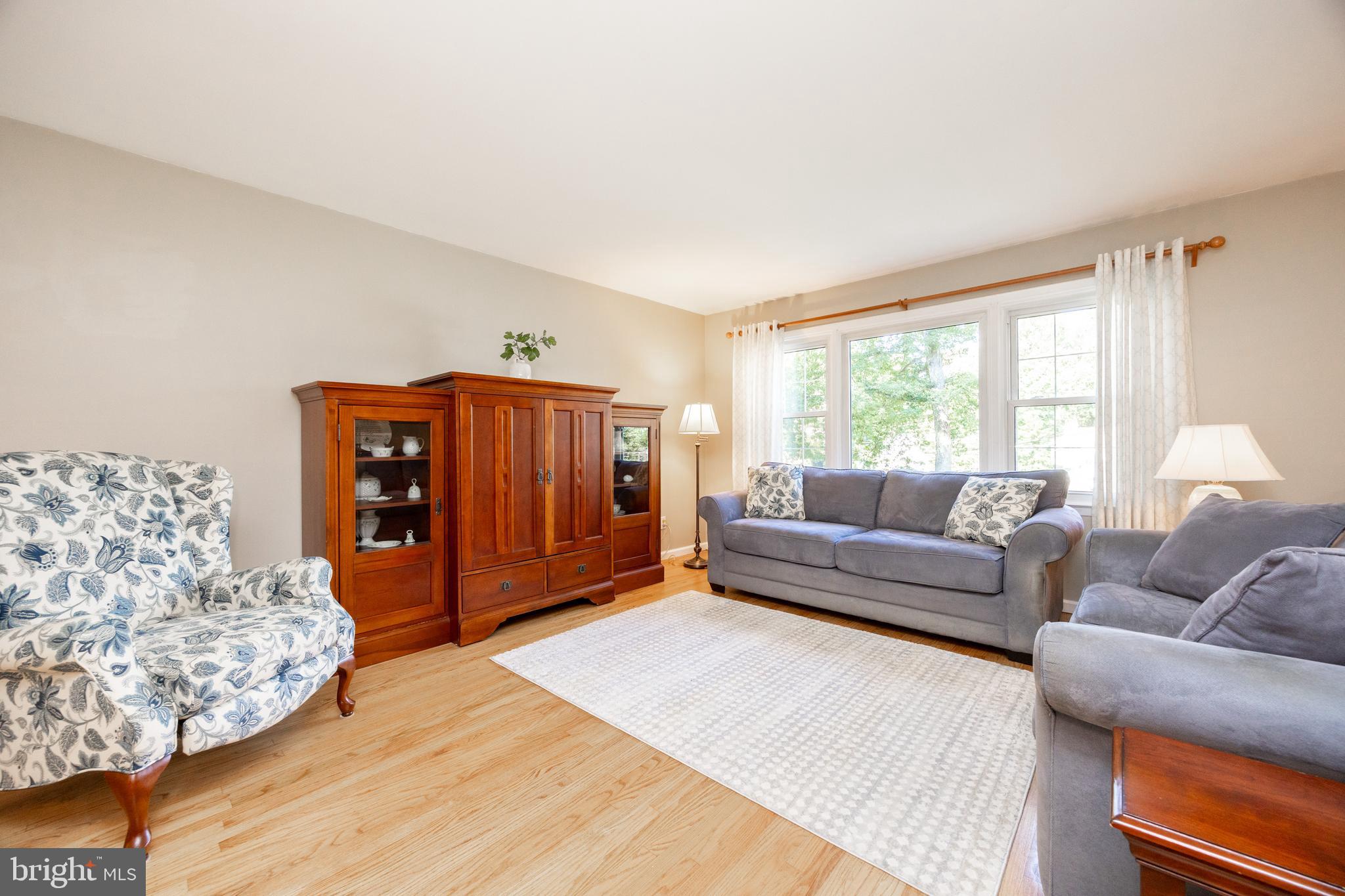 402 Concord Avenue Exton, PA 19341 - Photo 8 of 39 a living room with furniture and a large window